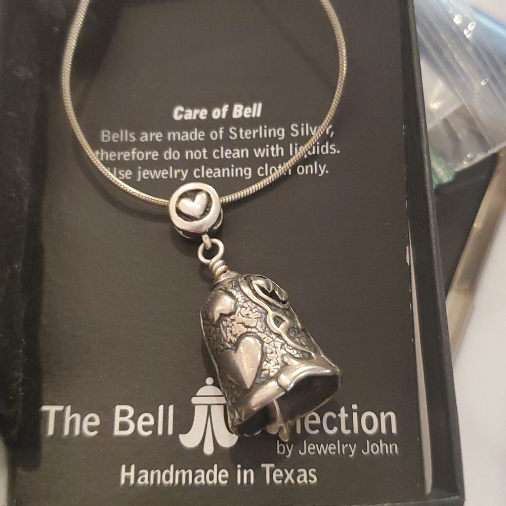 The bell collection bell with all papers and box.. This Does Not Include Chain.